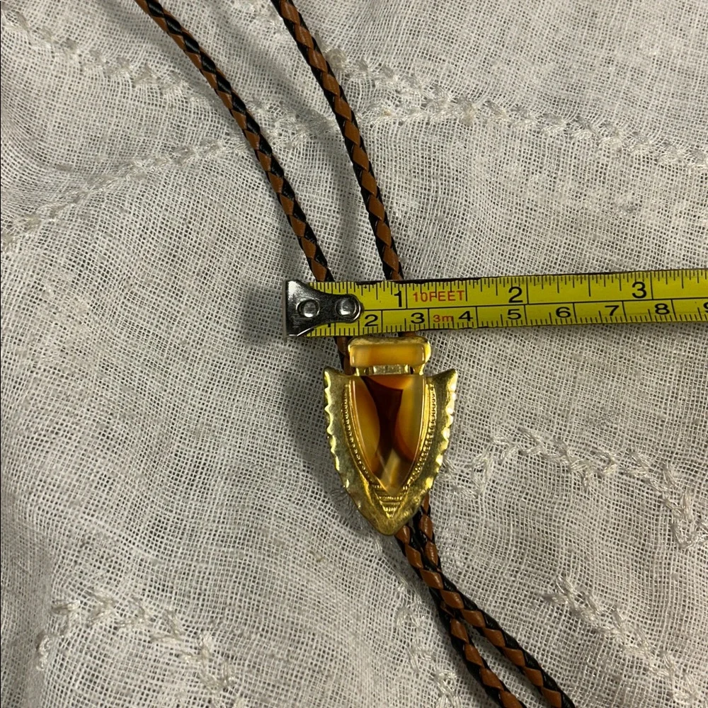Vintage Bolo tie western leather and ornate medallion with bullet ends